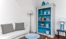 Casa 17 | Living room with comfortable sofa and library Casa 17, Sant Elmo, South Sardinia