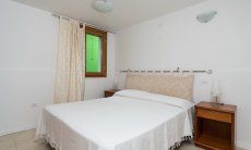 Villa del Campo | Bedroom 3 with double sized bed on the basement floor Villa del Campo, Is Molas, Pula