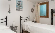 Villa del Campo | Bedroom 5 with two single beds on the basement floor Villa del Campo, Is Molas, Pula