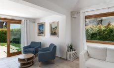 Villa del Campo | Living room with big windows to the green garden Villa del Campo, Is Molas, Pula