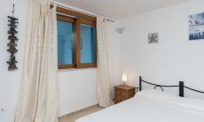 Villa del Campo | Bedroom 4 with double sized bed on the basement floor Villa del Campo, Is Molas, Pula