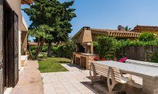 Villa Palme | Area equipped with brick barbeque and big dining table Villa Palme, Costa Rei