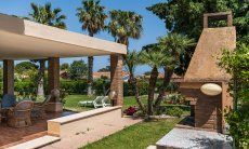 Villa Palme | Relax on the shady terrace or in the sun in the garden Villa Palme, Costa Rei