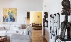 Villa Su Tauloni | The living room is decorated with ethnic furniture from all over the world Villa Su Tauloni, Is Molas, South Sardinia