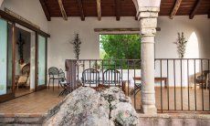 Villa Fiorita | Spacious, roofed terrace with dining table Portrait of the villa