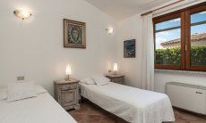 Villa Tiziana 11 | Bedroom 2 with two single beds that can be put together Portrait of the house