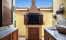 Villa Tiziana 11 | In the brick-built barbecue right beside the house and a handy working place and sink invites to try out your grilling skills Portrait of the house