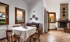 Villa Tiziana 11 | Spacious dining area with rustic dining table Portrait of the house
