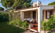 Villa Romana | Outdoor area with roofed terrace with dining table Outdoor area with garden and terrace