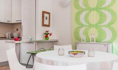 Villa Sandra 43 | Round dining table and view into the kitchen House
