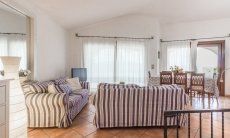 Villa Maestrale | Living room with comfortable sofa and panoramic windows Villa Maestrale, Cala Ginepro, Olbia