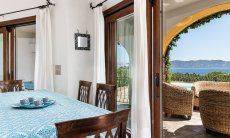 Villa Maestrale | Dining table with a view of the pool and the sea New picture