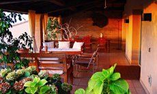 Villa Ulivi 27 | Terrace with dining table and sofas V. Ulivi 27