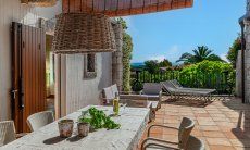 Li Conchi 44 | The terrace with view into the garden and the sea in the distance New Picture 2025