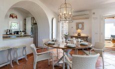Li Conchi 33 | Dining table and kitchen with view onto the terrace New Picture 2025