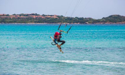 Kitesurfer on the beach La Cinta, San Teodoro, Olbia