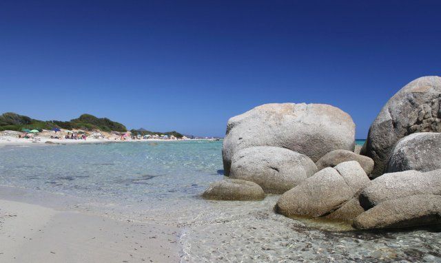Sant Elmo beach with crystal clear water and granite rocks Sant Elmo beach with crystal clear water and granite rocks