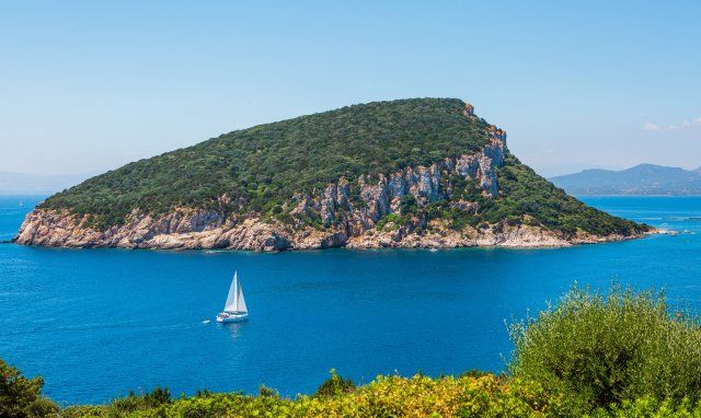 Sailing boat in front of the isle Figarolo, Golfo Aranci